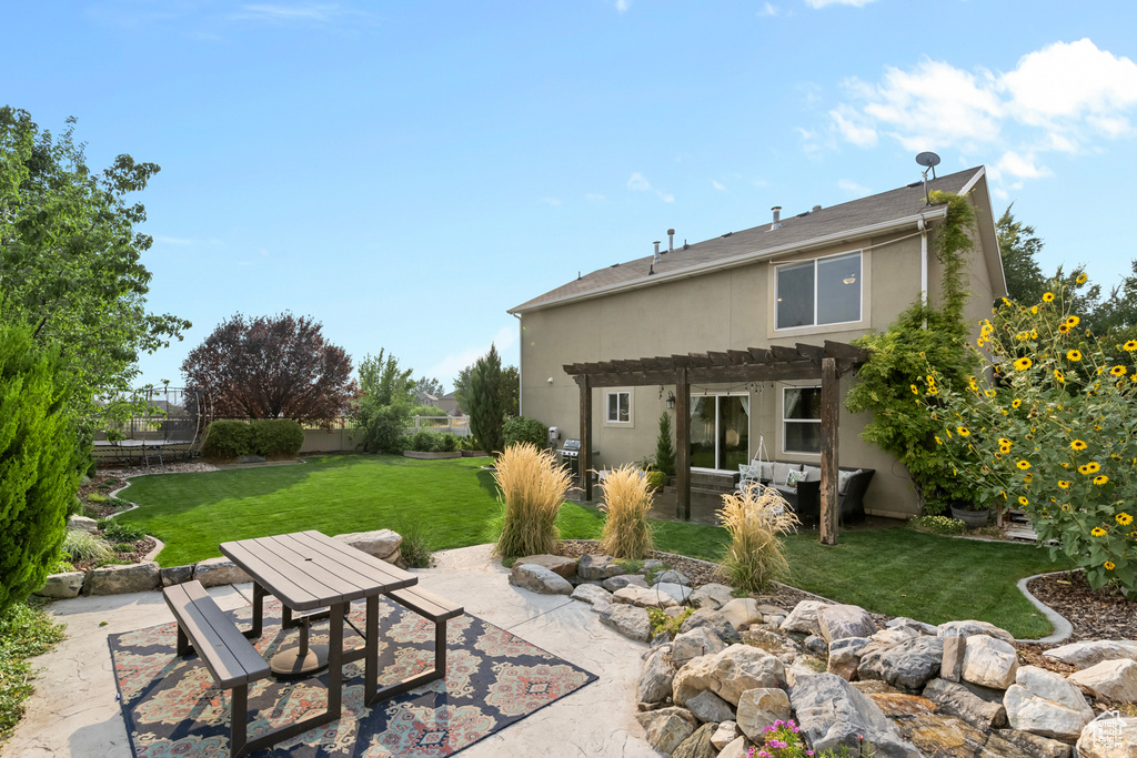 Exterior space featuring a yard and a patio