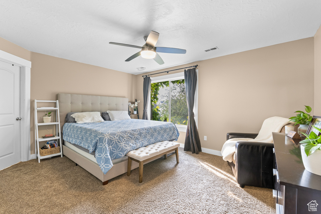 Bedroom with carpet flooring and ceiling fan