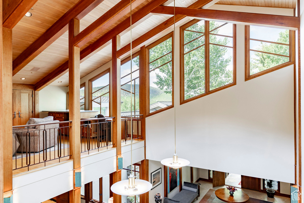 Living room featuring a wood ceiling with exposed beams
