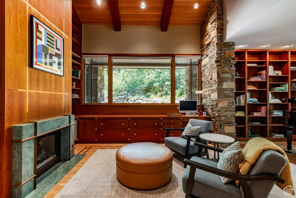 Sitting room featuring wooden ceiling, decorative columns, beam ceiling, recessed lighting, and wood finished floors
