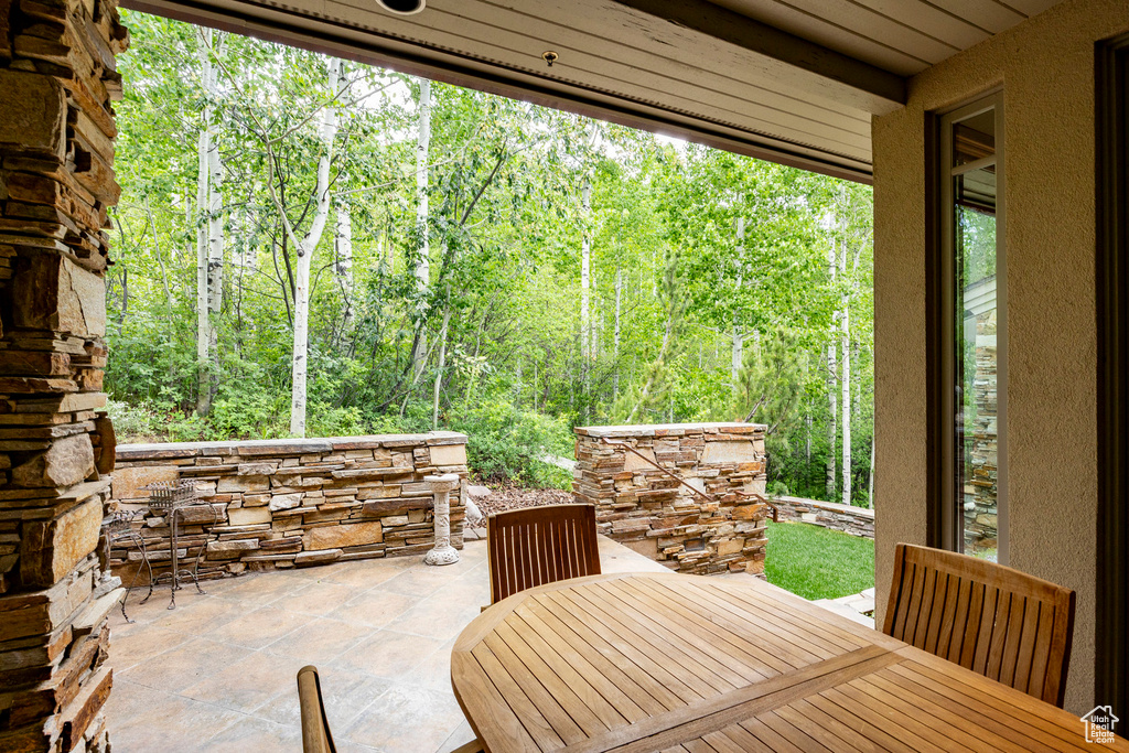 View of patio with outdoor dining area