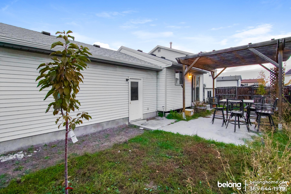 Exterior space with a patio area and a pergola