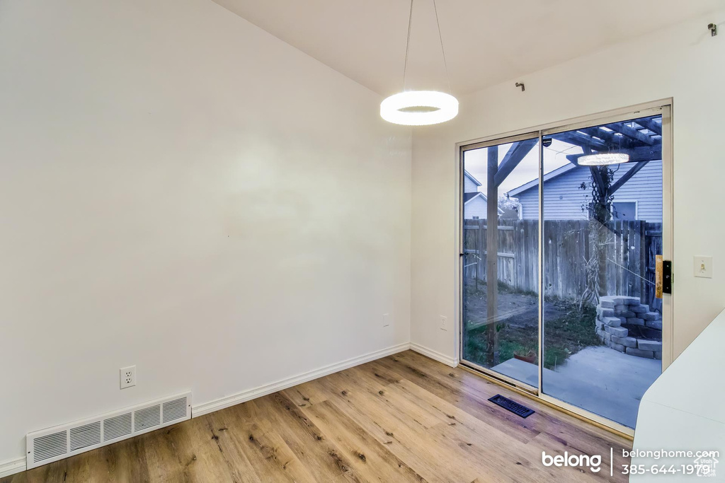 Spare room featuring hardwood / wood-style floors