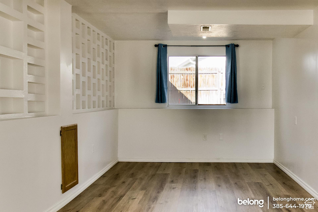 Spare room with hardwood / wood-style flooring