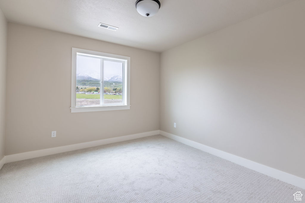 Empty room featuring carpet