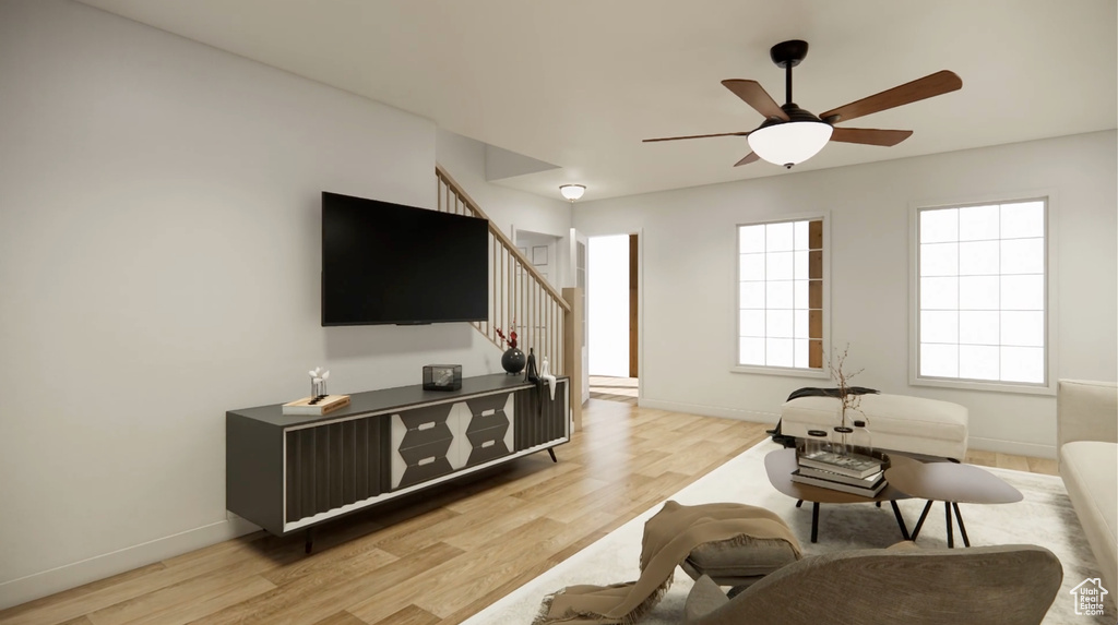 Living room featuring light wood-type flooring and ceiling fan