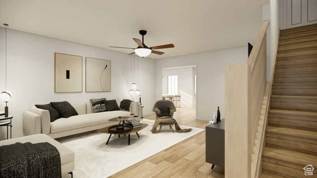 Living room with ceiling fan and light wood-type flooring