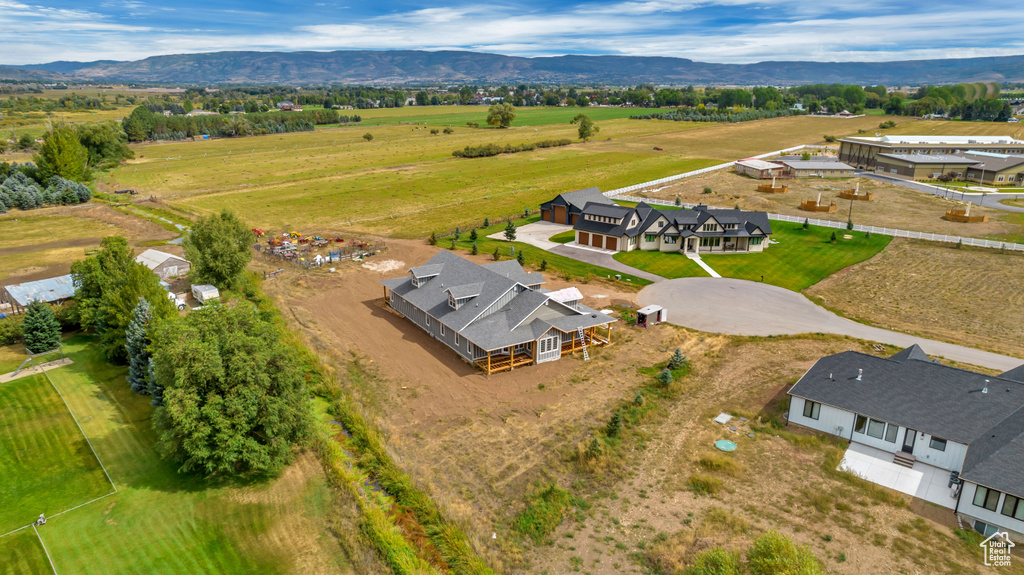 Aerial view featuring a rural view and a mountain view