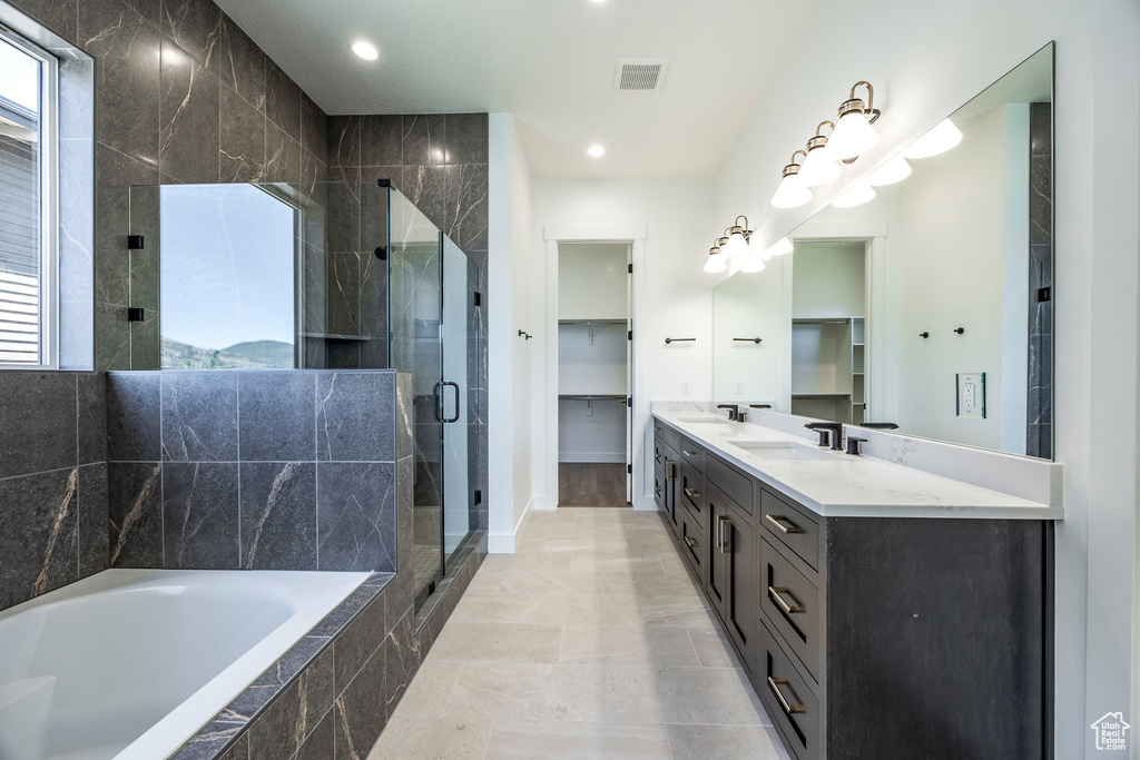 Bathroom with vanity and plus walk in shower