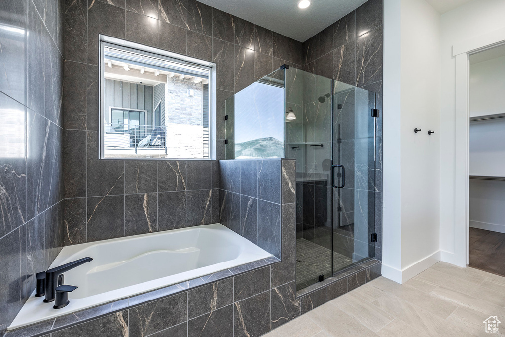 Bathroom featuring independent shower and bath