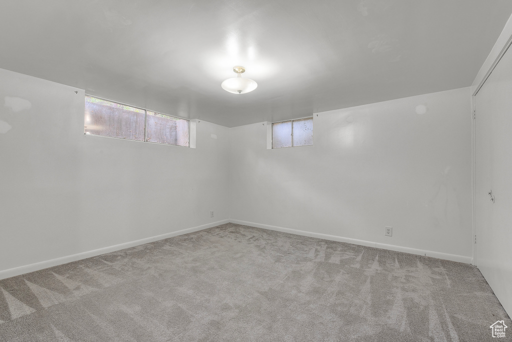 Basement with light carpet