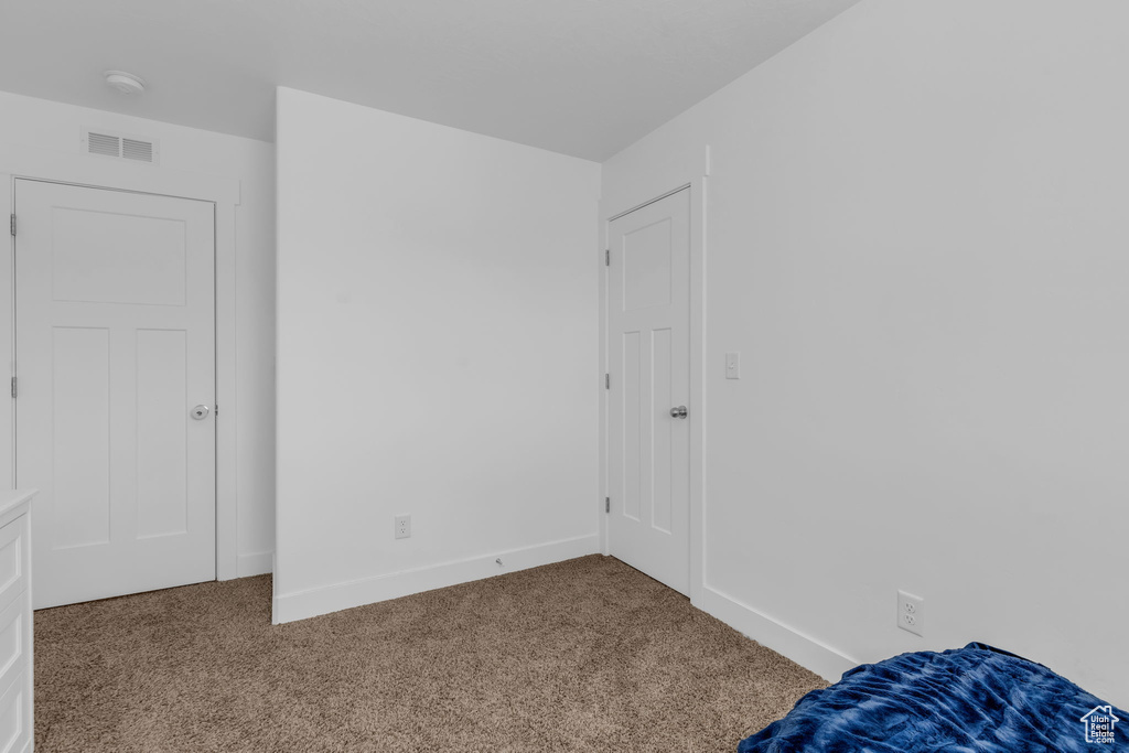 Unfurnished bedroom featuring carpet flooring