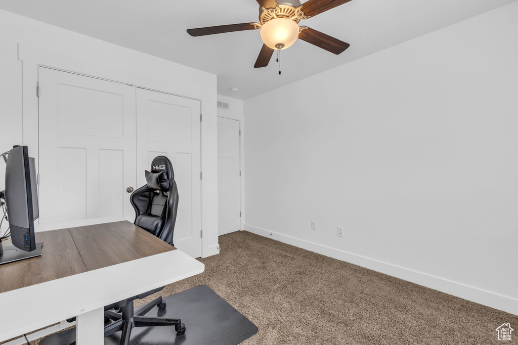 Office featuring ceiling fan and carpet floors