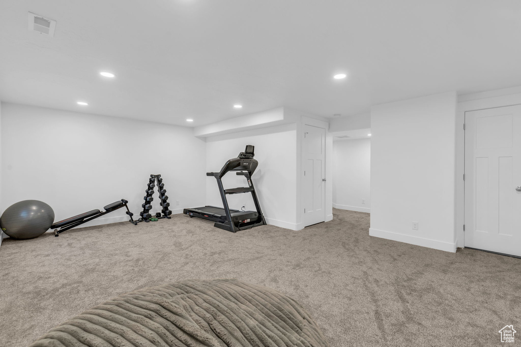 Exercise area featuring carpet floors