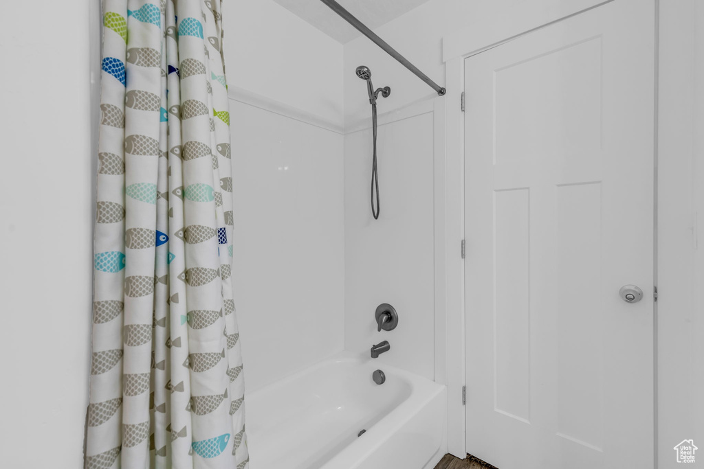 Bathroom with shower / bath combo with shower curtain