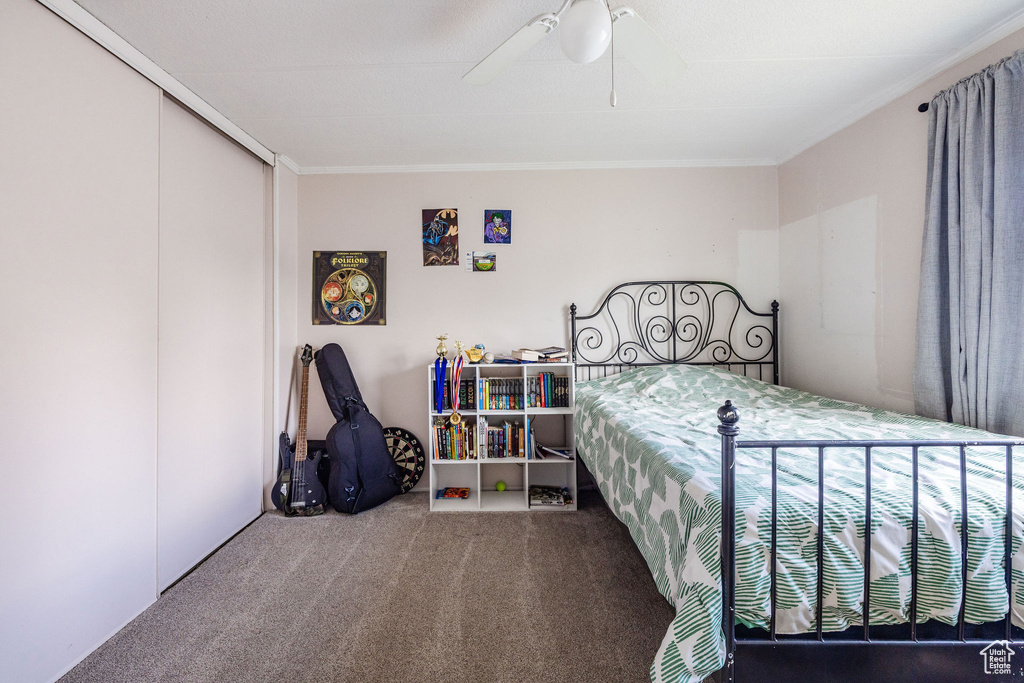 Carpeted bedroom with ceiling fan