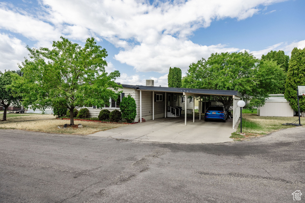 View of front facade featuring a carport