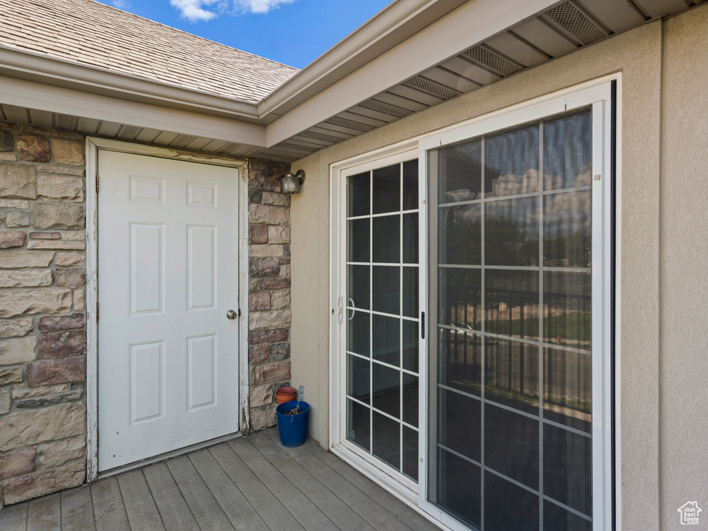 Doorway to property with a wooden deck