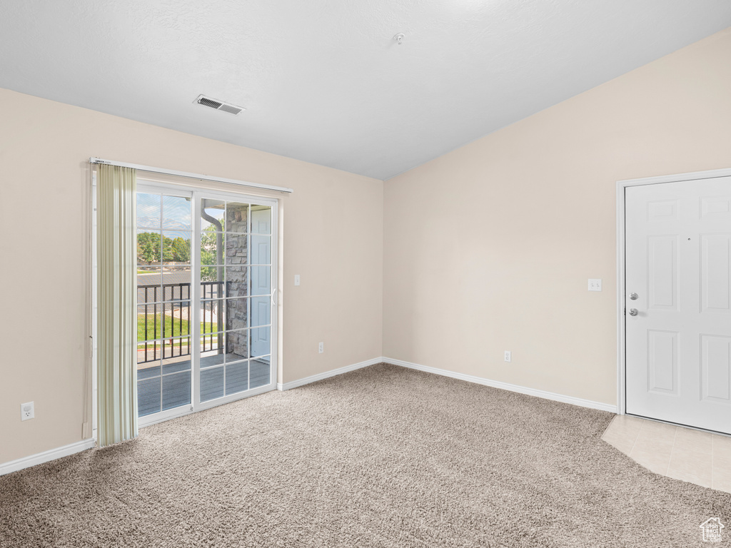 Empty room with carpet floors