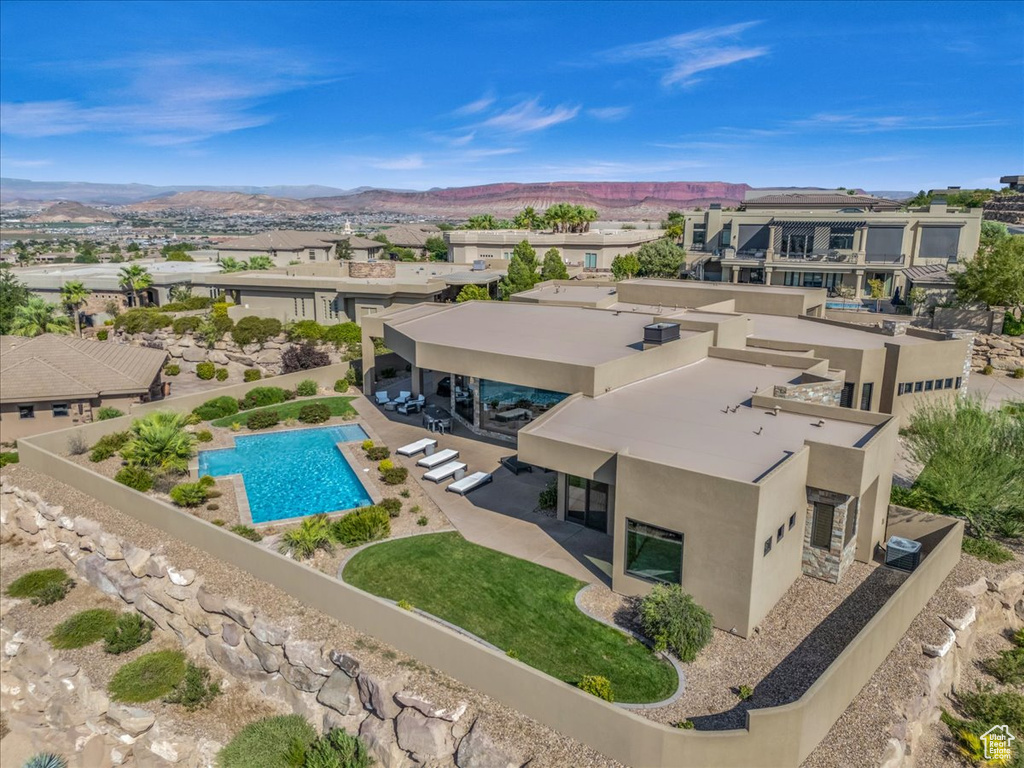 Birds eye view of property with a mountain view