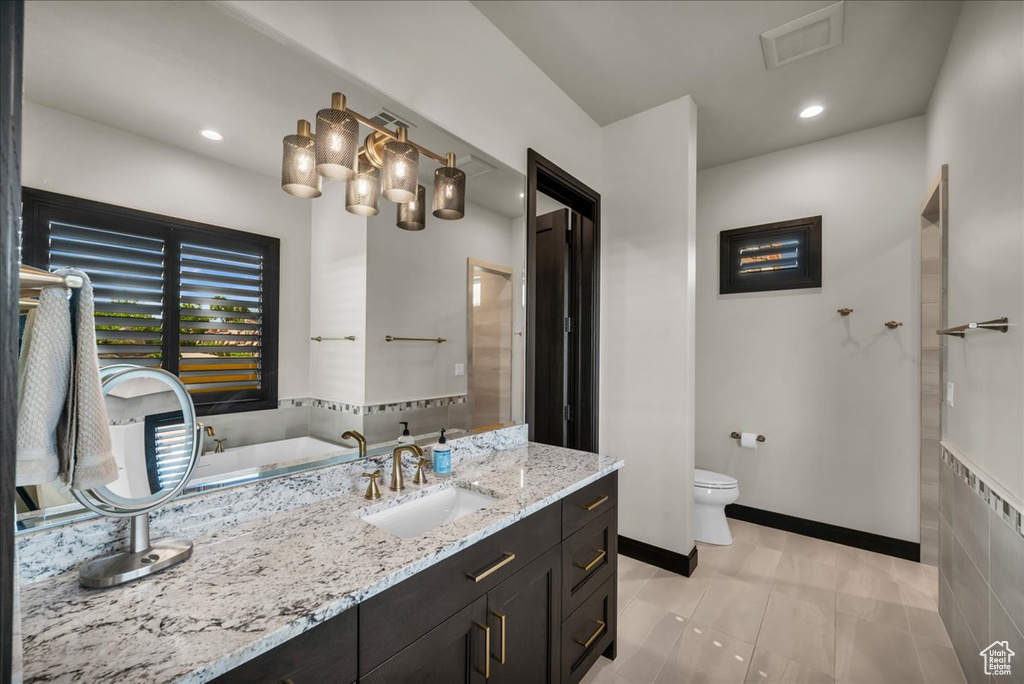 Bathroom with vanity and toilet