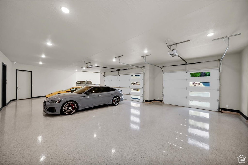 Garage featuring a garage door opener