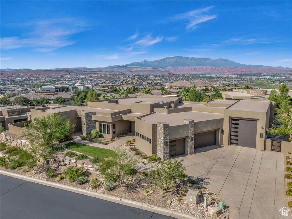 Exterior space with a mountain view and a garage