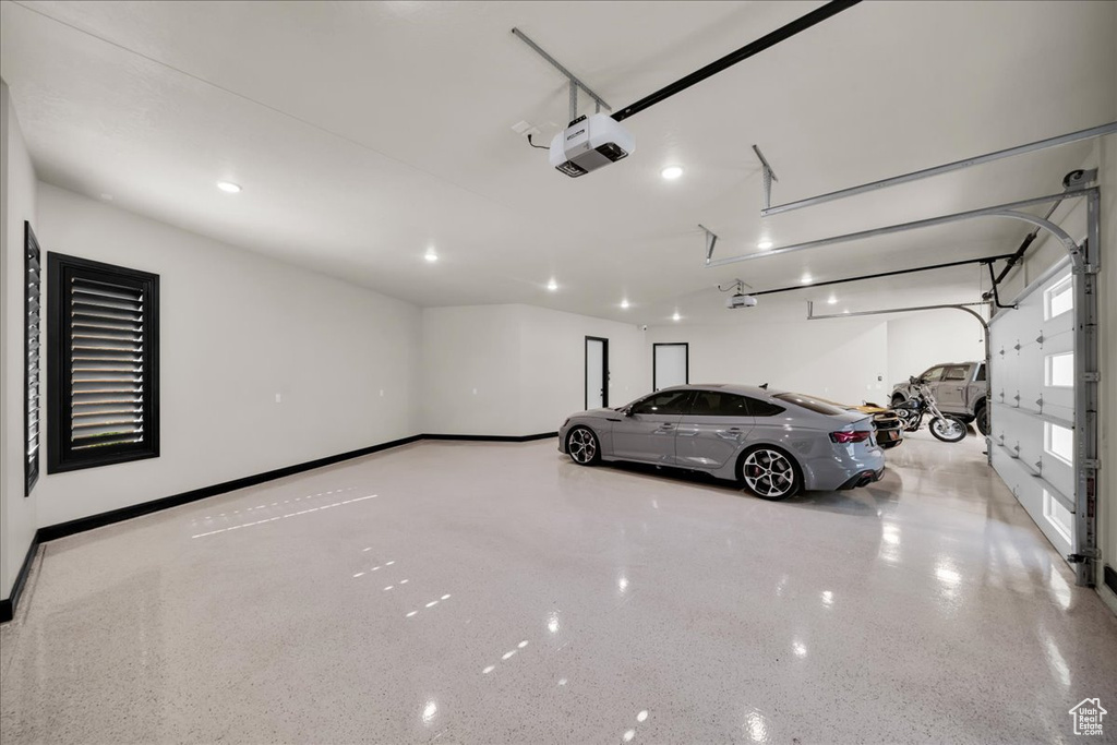 Garage featuring a garage door opener