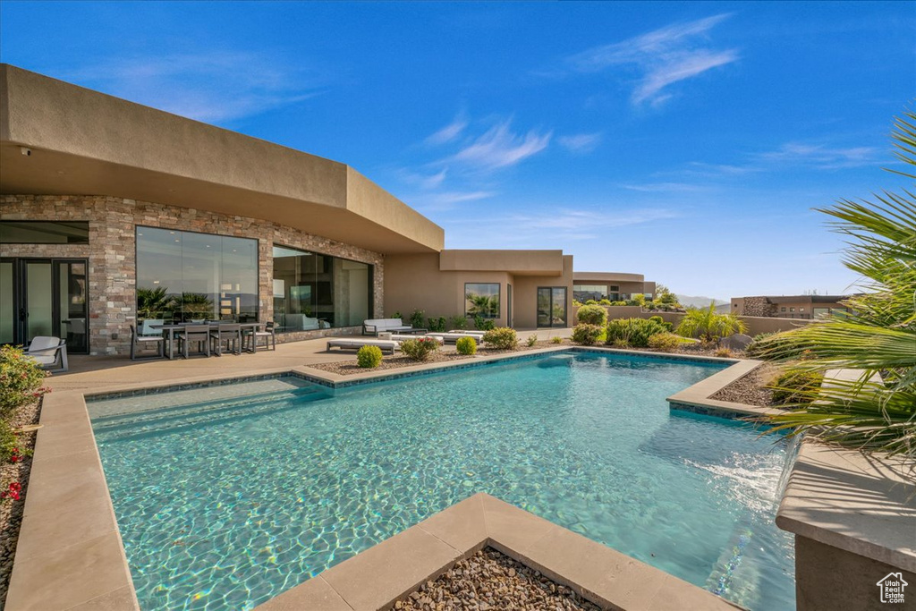 View of swimming pool with a patio