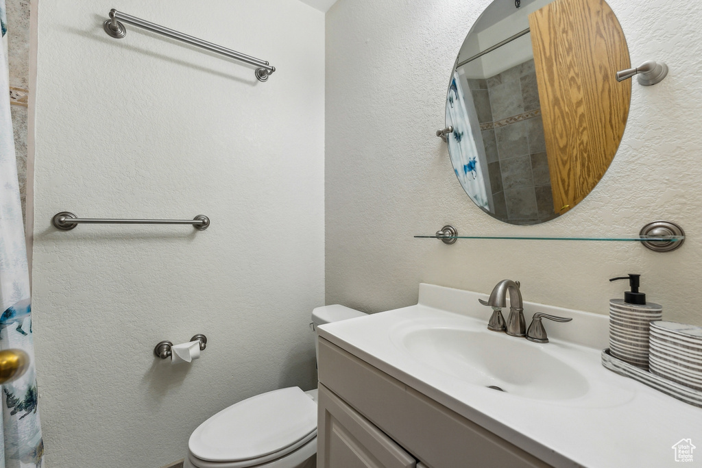 Bathroom with vanity and toilet