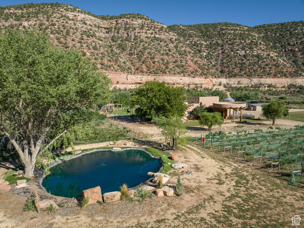 Property view of mountains with a rural view