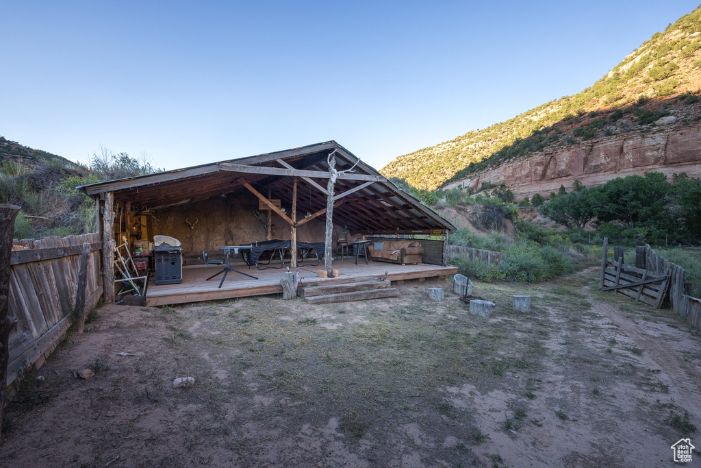 Exterior space featuring a deck with mountain view