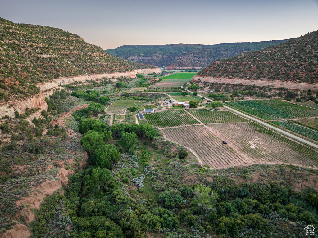 Aerial view at dusk featuring a rural view