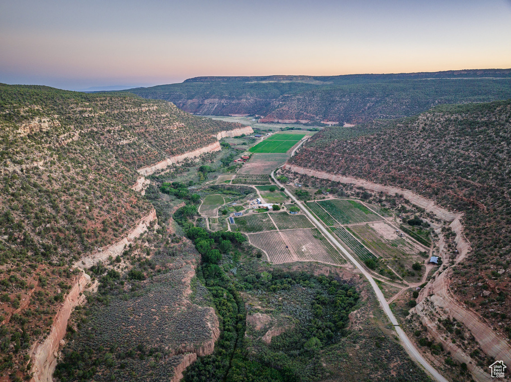 Aerial view at dusk featuring a rural view