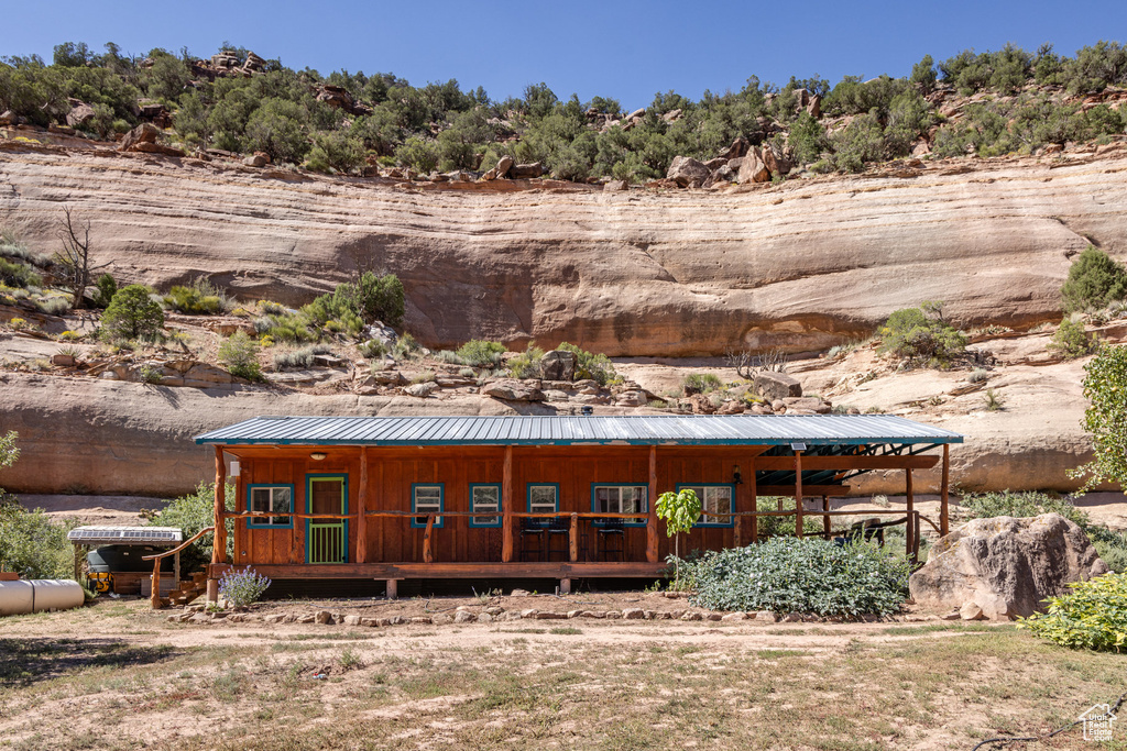 Rear view of property with a porch