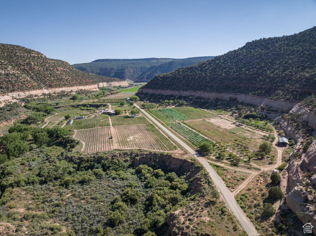 Birds eye view of property featuring a mountain view and a rural view