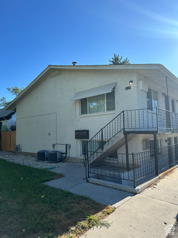 View of front of house featuring central air condition unit