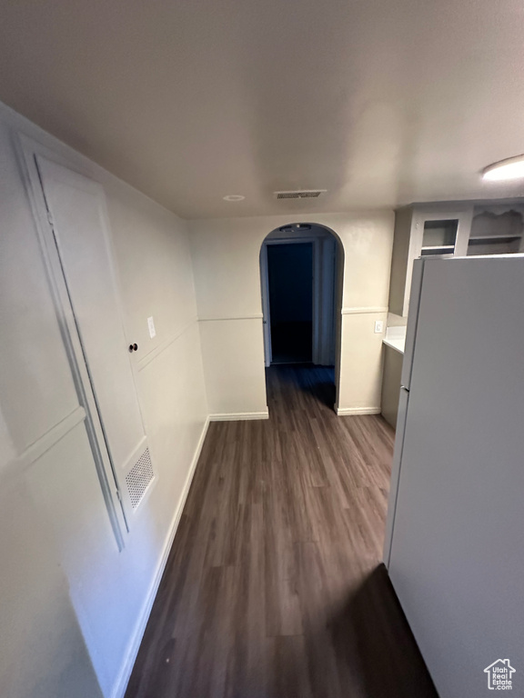 Corridor featuring dark hardwood / wood-style floors