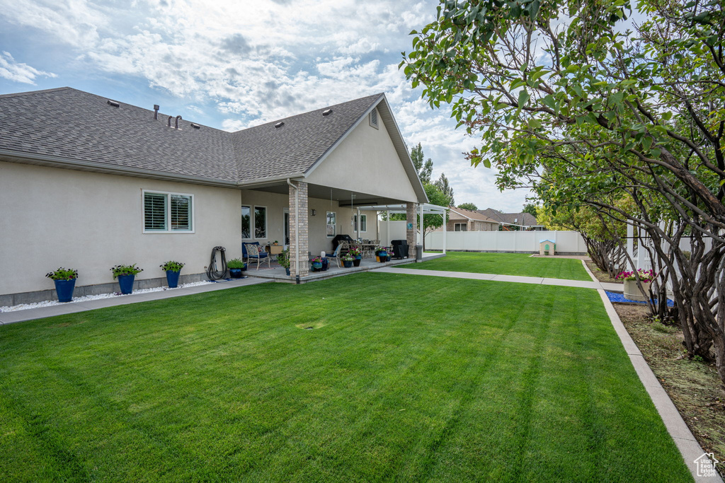 View of yard with a patio