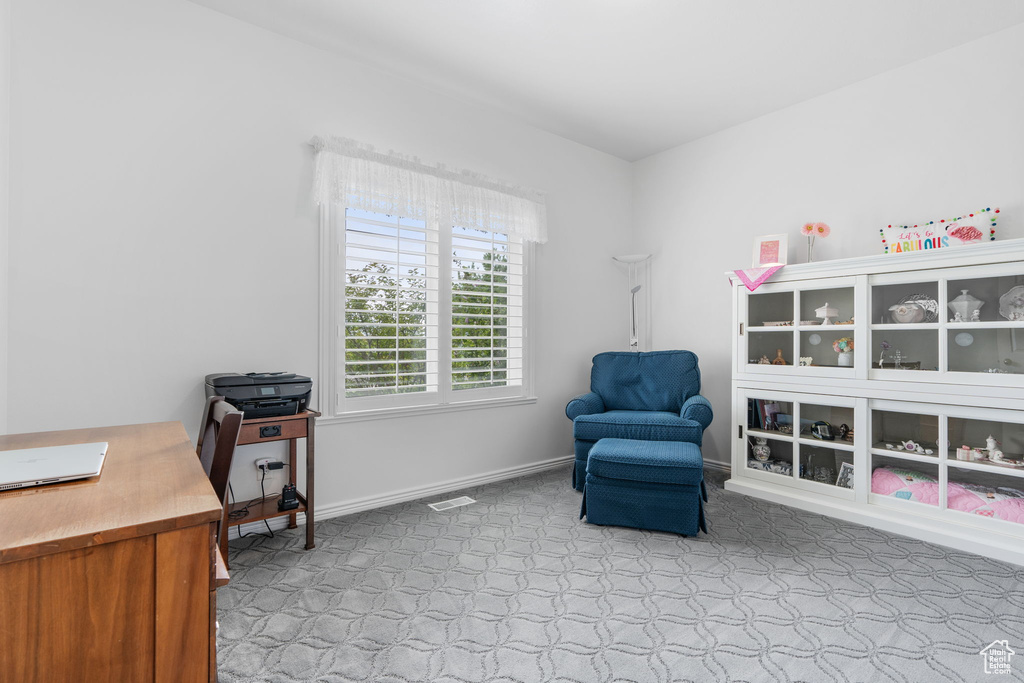 Sitting room with light colored carpet