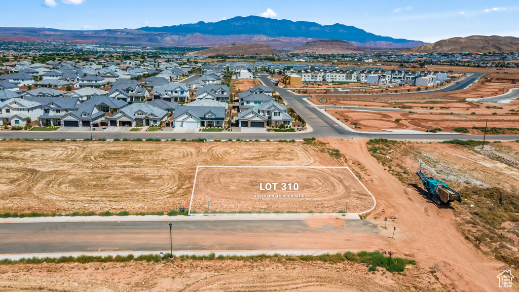 Birds eye view of property with a mountain view