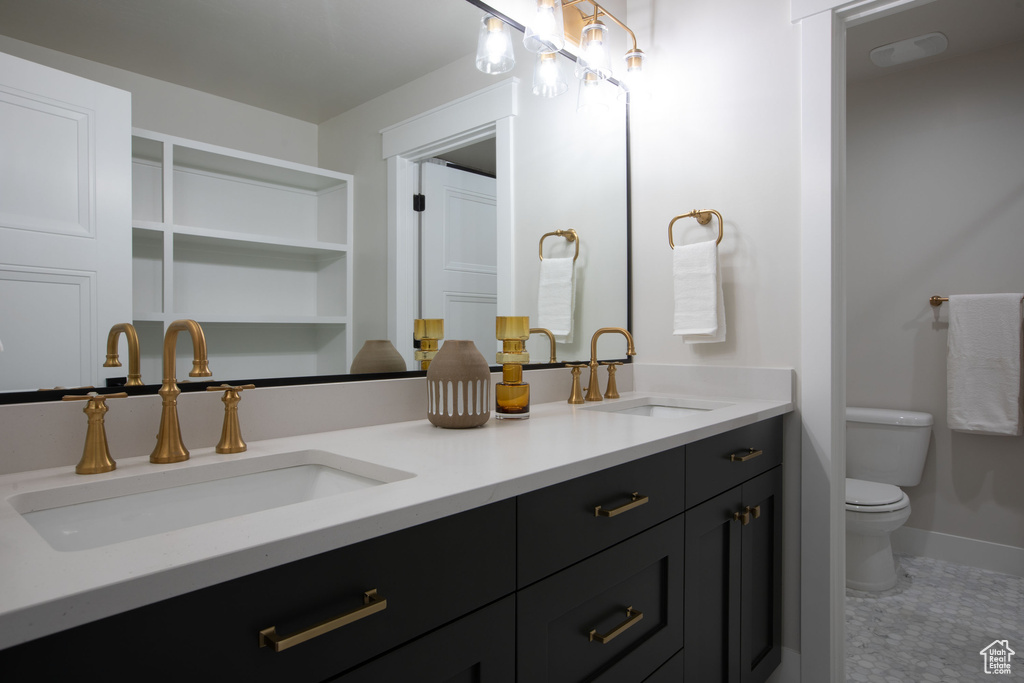 Bathroom with vanity and toilet