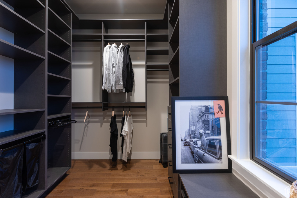 Walk in closet featuring hardwood / wood-style floors