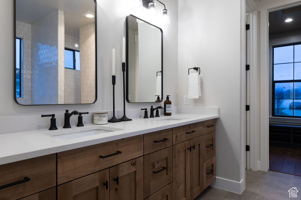 Bathroom with vanity and tile patterned floors