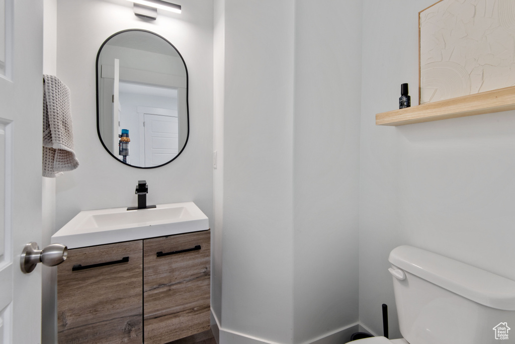 Bathroom featuring vanity and toilet