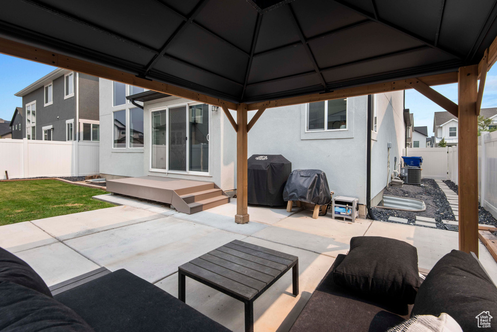 View of patio featuring grilling area and a gazebo