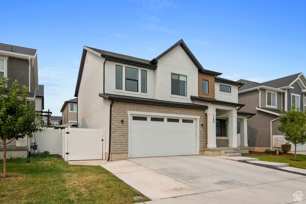 View of front of home featuring a garage