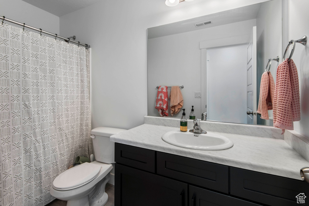 Bathroom with vanity and toilet