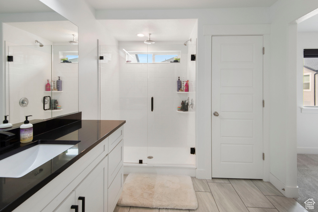 Bathroom with vanity and walk in shower