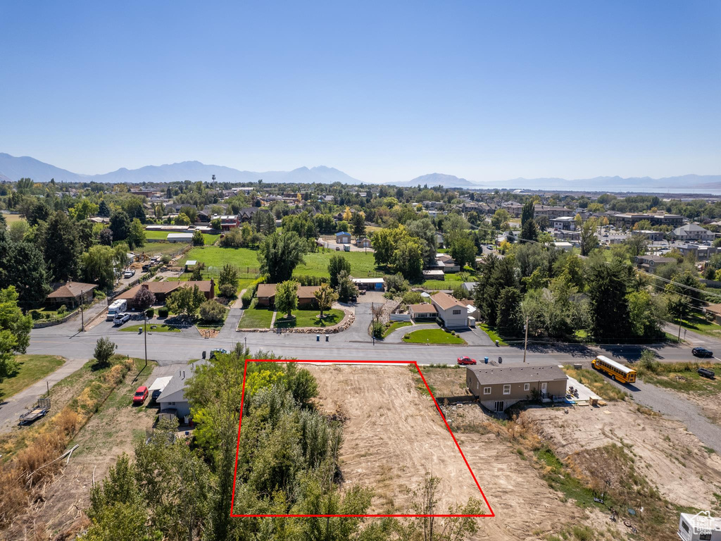 Birds eye view of property with a mountain view